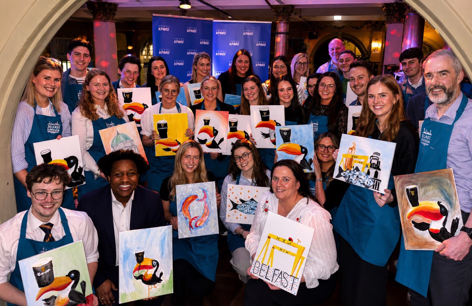 A corporate team with their finished canvases
