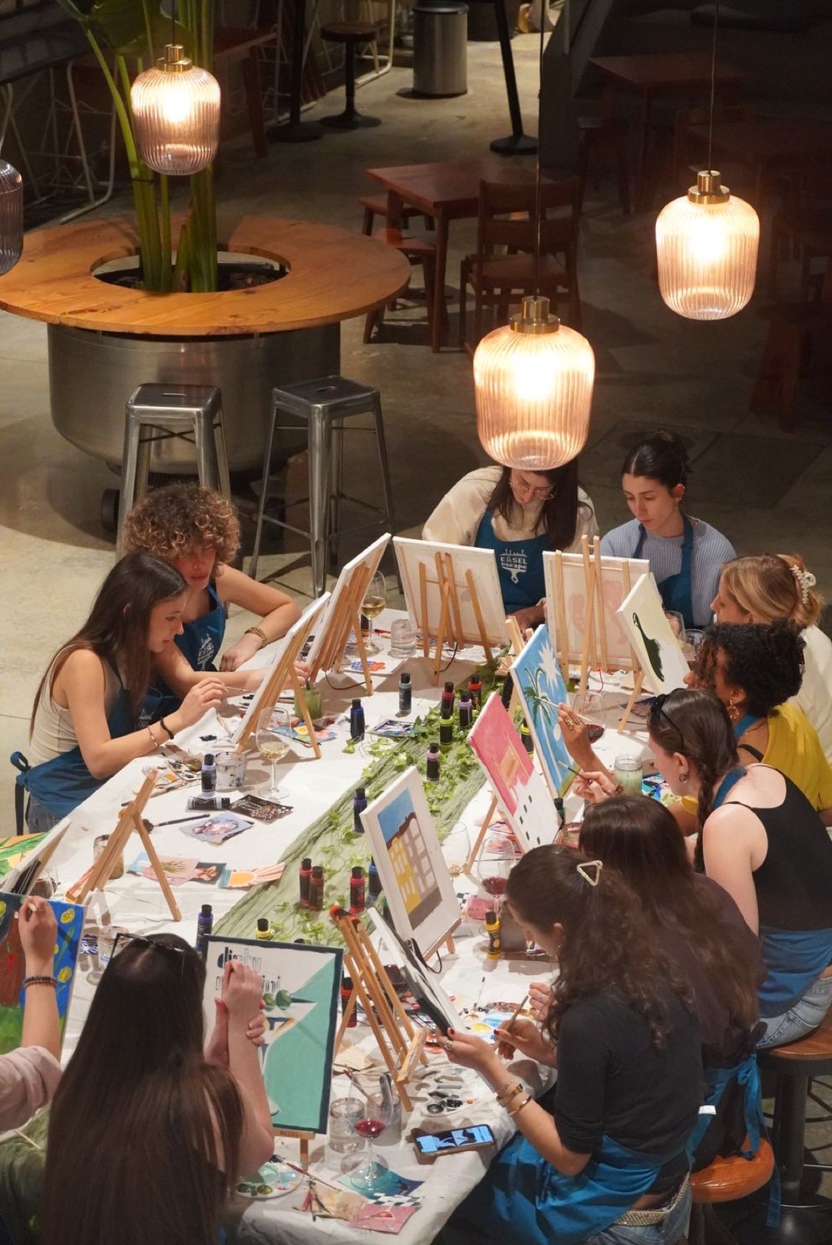 The long table at a Paint & Wine night from above